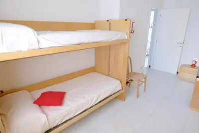 Letto o letti in una camera di Bagni Miramare Apartments