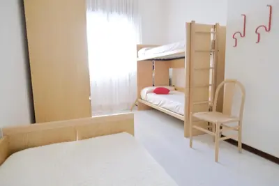 Letto o letti in una camera di Bagni Miramare Apartments