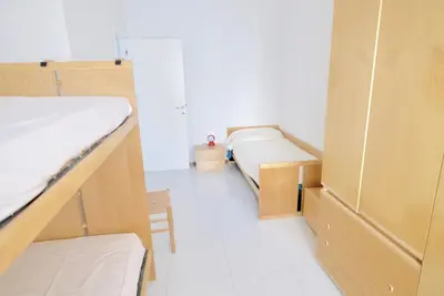 Letto o letti in una camera di Bagni Miramare Apartments
