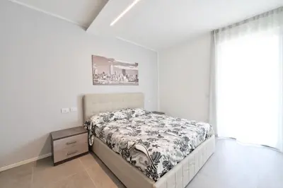 Letto o letti in una camera di Baia Blu Apartments