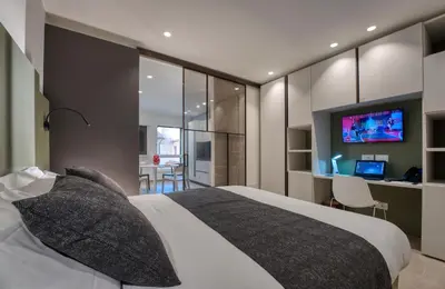 Letto o letti in una camera di Cà Murà - Residence Belle Parti