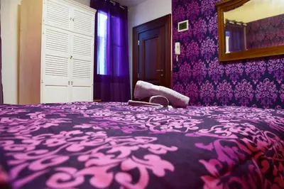 Letto o letti in una camera di Venice Rainbow Apartment San Marco 540