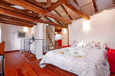 Letto o letti in una camera di Glass House - Loft 2 minutes to Rialto Bridge & View