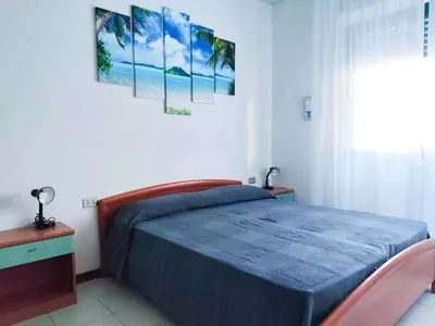 Letto o letti in una camera di Apartments in Lido di Jesolo 25361