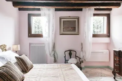 Letto o letti in una camera di Biennale, Corte dell' Angelo, una casa romantica