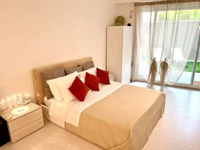 Letto o letti in una camera di GINNY HOUSE VENEZIA - appartamento moderno open Space vicino Venezia e Padova