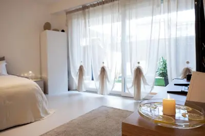 Letto o letti in una camera di GINNY HOUSE VENEZIA - appartamento moderno open Space vicino Venezia e Padova