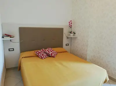 Letto o letti in una camera di B&B Metropols Sottomarina