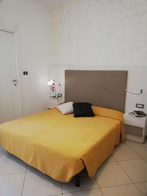 Letto o letti in una camera di B&B Metropols Sottomarina