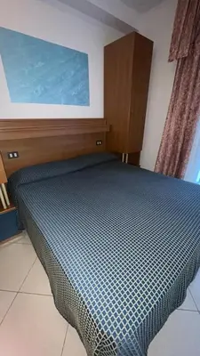 Letto o letti in una camera di B&B Metropols Sottomarina