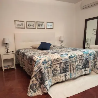 Letto o letti in una camera di Casa del Capitano