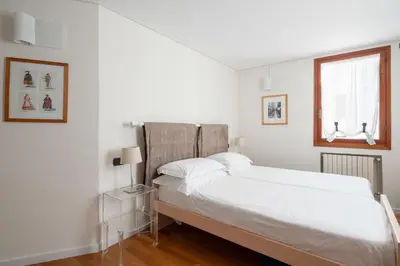 Letto o letti in una camera di Ca' Coriandolo