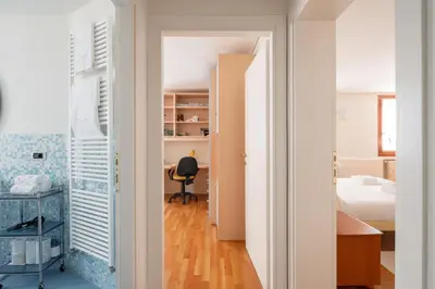 Letto o letti in una camera di Ca' Coriandolo