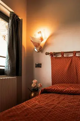 Letto o letti in una camera di Hotel Liberty