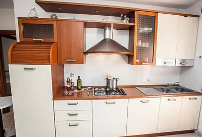 Cucina o angolo cottura di Seaside serenity flat with outdoor pool