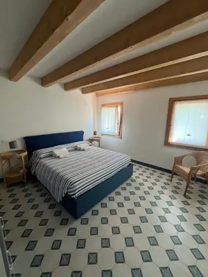 Letto o letti in una camera di Appartamento Fronte Laguna Ca’Nonica