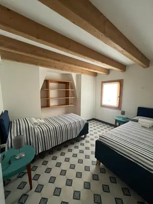 Letto o letti in una camera di Appartamento Fronte Laguna Ca’Nonica