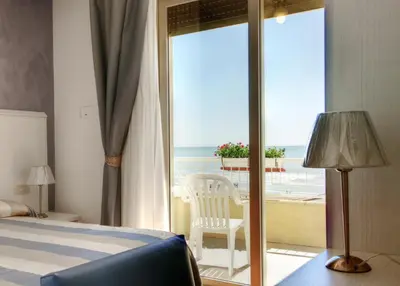 Letto o letti in una camera di Hotel Telenia