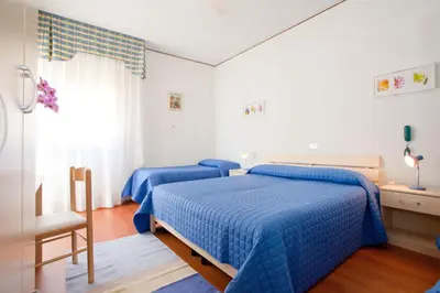 Letto o letti in una camera di Hotel Telenia