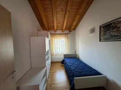 Letto o letti in una camera di Cà Maria - Appartamento Mansardato al primo piano