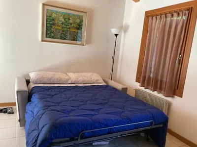 Letto o letti in una camera di Cà Maria - Appartamento Mansardato al primo piano
