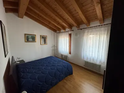 Letto o letti in una camera di Cà Maria - Appartamento Mansardato al primo piano