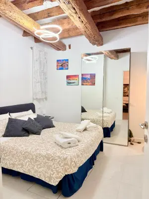 Letto o letti in una camera di Ca' Spritz - Home