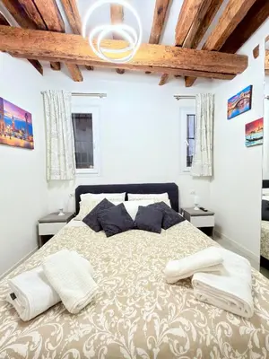 Letto o letti in una camera di Ca' Spritz - Home