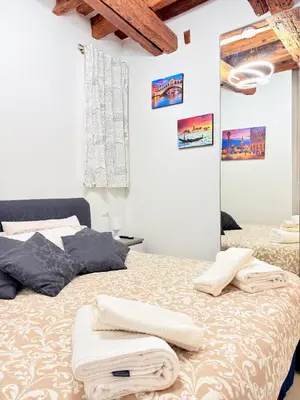 Letto o letti in una camera di Ca' Spritz - Home