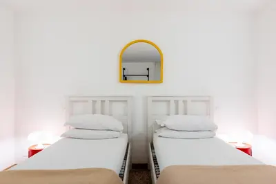 Letto o letti in una camera di AtoLiving Greci