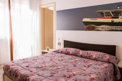 Letto o letti in una camera di Appartamenti Sottomarina