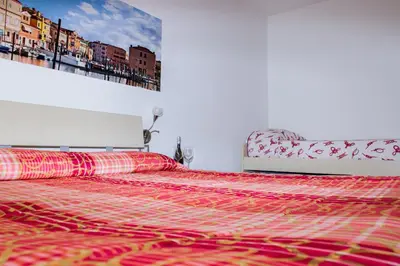 Letto o letti in una camera di Appartamenti Sottomarina