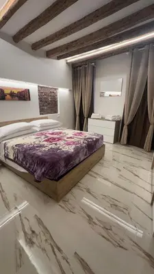 Letto o letti in una camera di Ca lucia Canal View