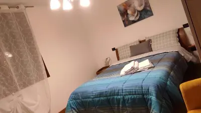 Letto o letti in una camera di Appartamento LA PERLA