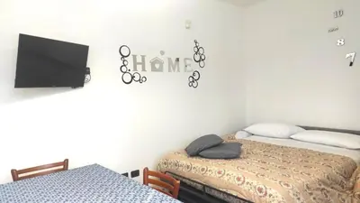 Letto o letti in una camera di Appartamento LA PERLA