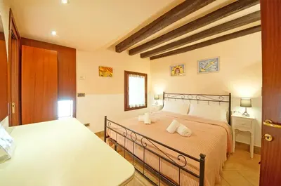 Letto o letti in una camera di Santa Croce WIFI S.G. Dellorio coop