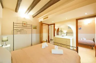 Letto o letti in una camera di Santa Croce WIFI S.G. Dellorio coop
