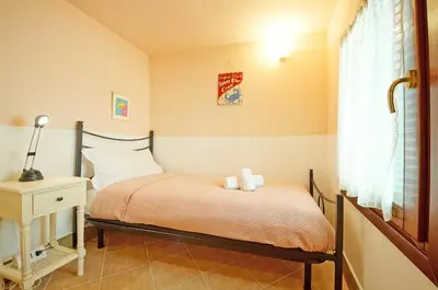 Letto o letti in una camera di Santa Croce WIFI S.G. Dellorio coop
