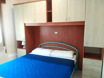 Letto o letti in una camera di Holiday Homes in Rosolina Mare 48310