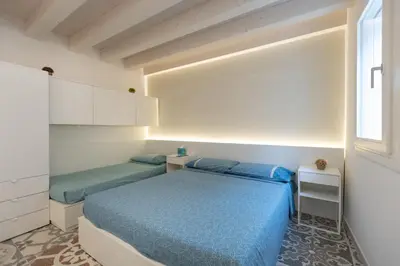 Letto o letti in una camera di Appartamenti Incanto e MaGiCà - Casa Boscolo Luxury