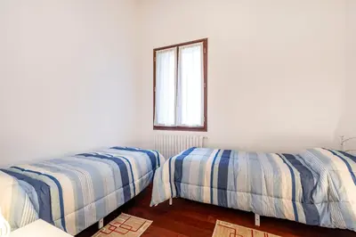Letto o letti in una camera di Palazzo Boito Luxury Apartment on Lido with Venice view