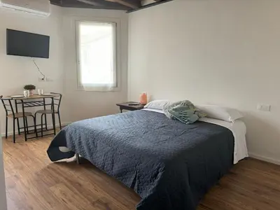 Letto o letti in una camera di Casa Toè Quinto
