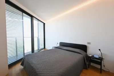 Letto o letti in una camera di Torre Aquileia Apartments
