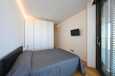 Letto o letti in una camera di Torre Aquileia Apartments