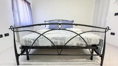 Letto o letti in una camera di Casa Raffi by Ca-Sa Check
