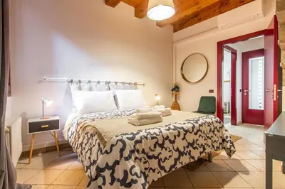 Letto o letti in una camera di CASA MARGHERITA Basilica view & Terrace