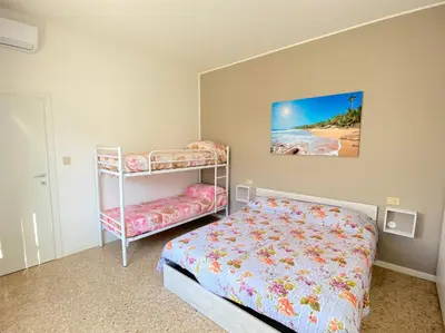 Letto o letti in una camera di Cellini - Carraro Immobiliare - Family Apartments