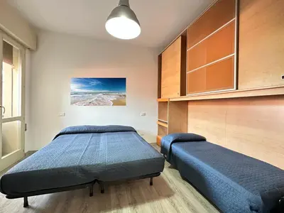 Letto o letti in una camera di Cellini - Carraro Immobiliare - Family Apartments