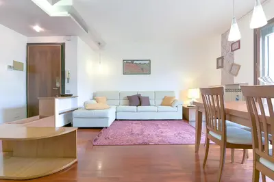 Area soggiorno di Queen Home Paola