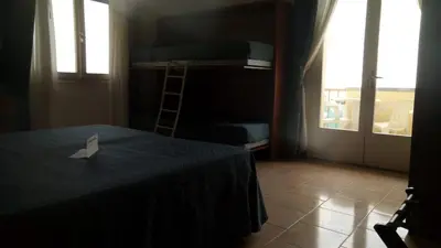 Letto o letti in una camera di Hotel Heron